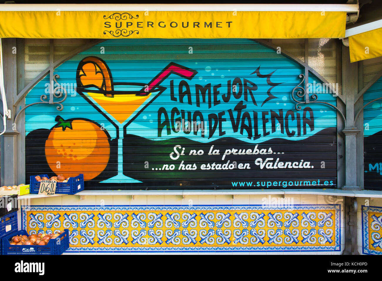 Valencia food drink, an advertisement for Agua de Valencia on the shutters of a fresh orange kiosk next to the Mercado central in Valencia, Spain. Stock Photo