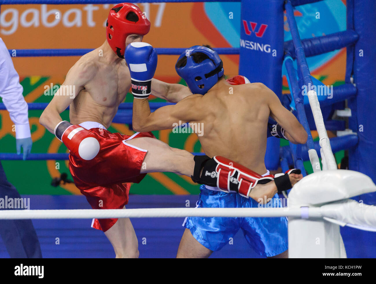 Ashgabat 2017 - 5th Asian Indoor & MartialArts Games 24-09-2017. Kickboxing - Chingiskhan Tlemissov (KAZ) v Muhammet Altybayew (TKM) - Mens LK 63.5Kg  Stock Photo