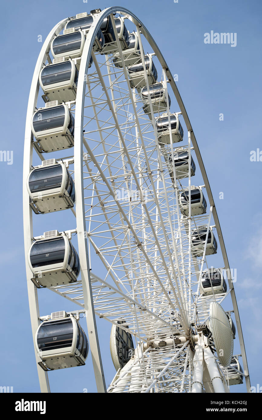 Ferris wheel against blue sky Stock Photo - Alamy
