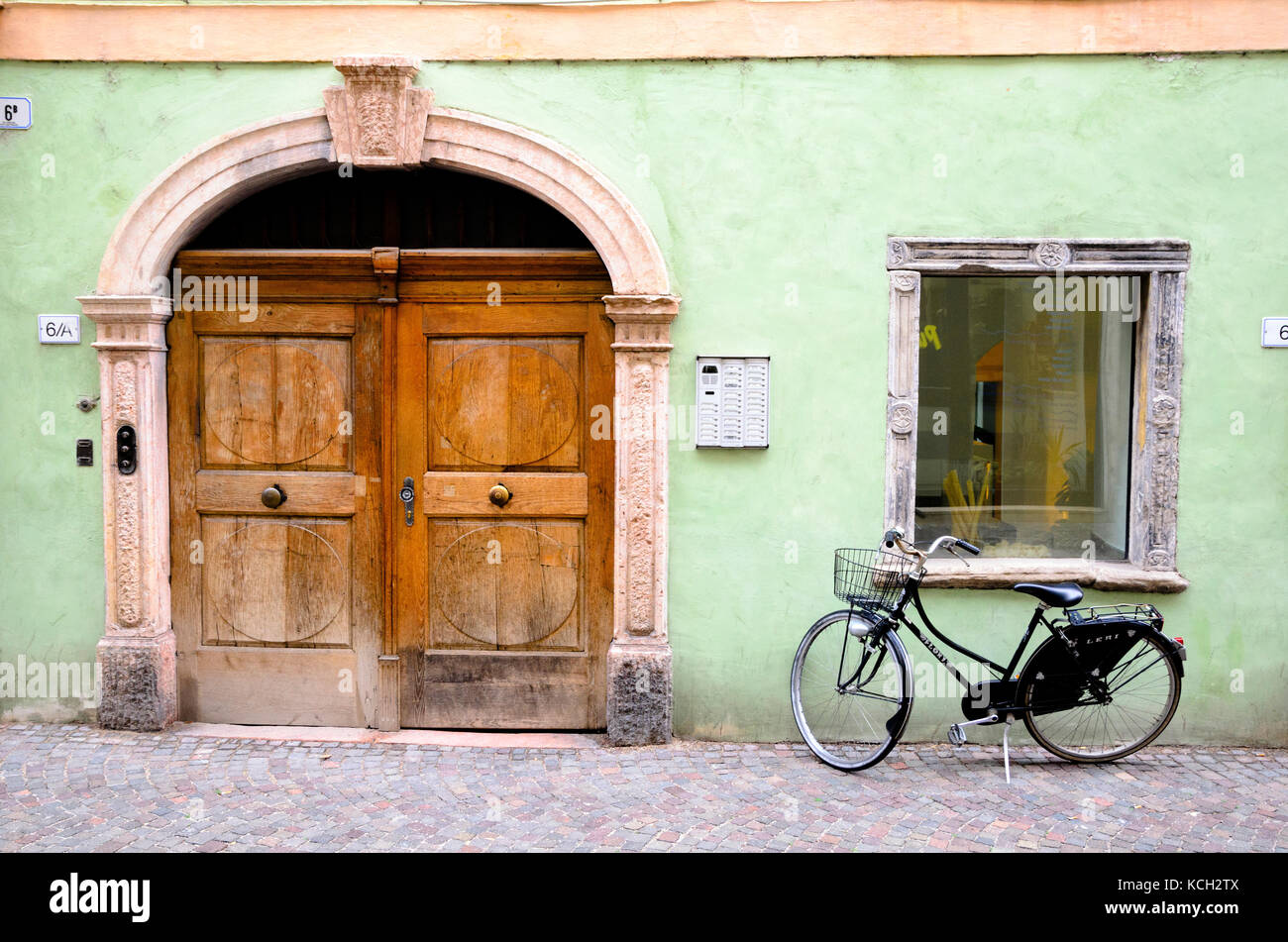 Front door and bicycle - Bolzano, Italy Stock Photo
