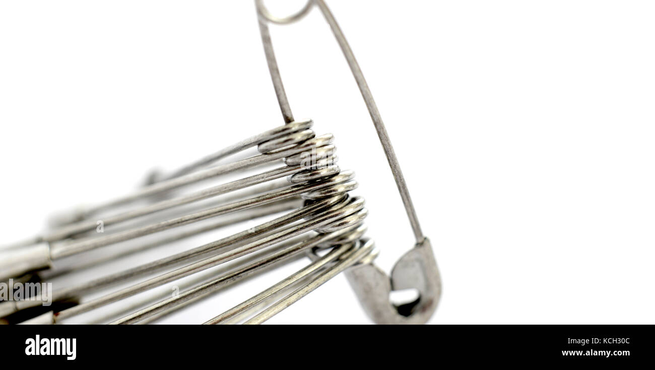sewing safety pin macro on a white background,image Stock Photo Alamy