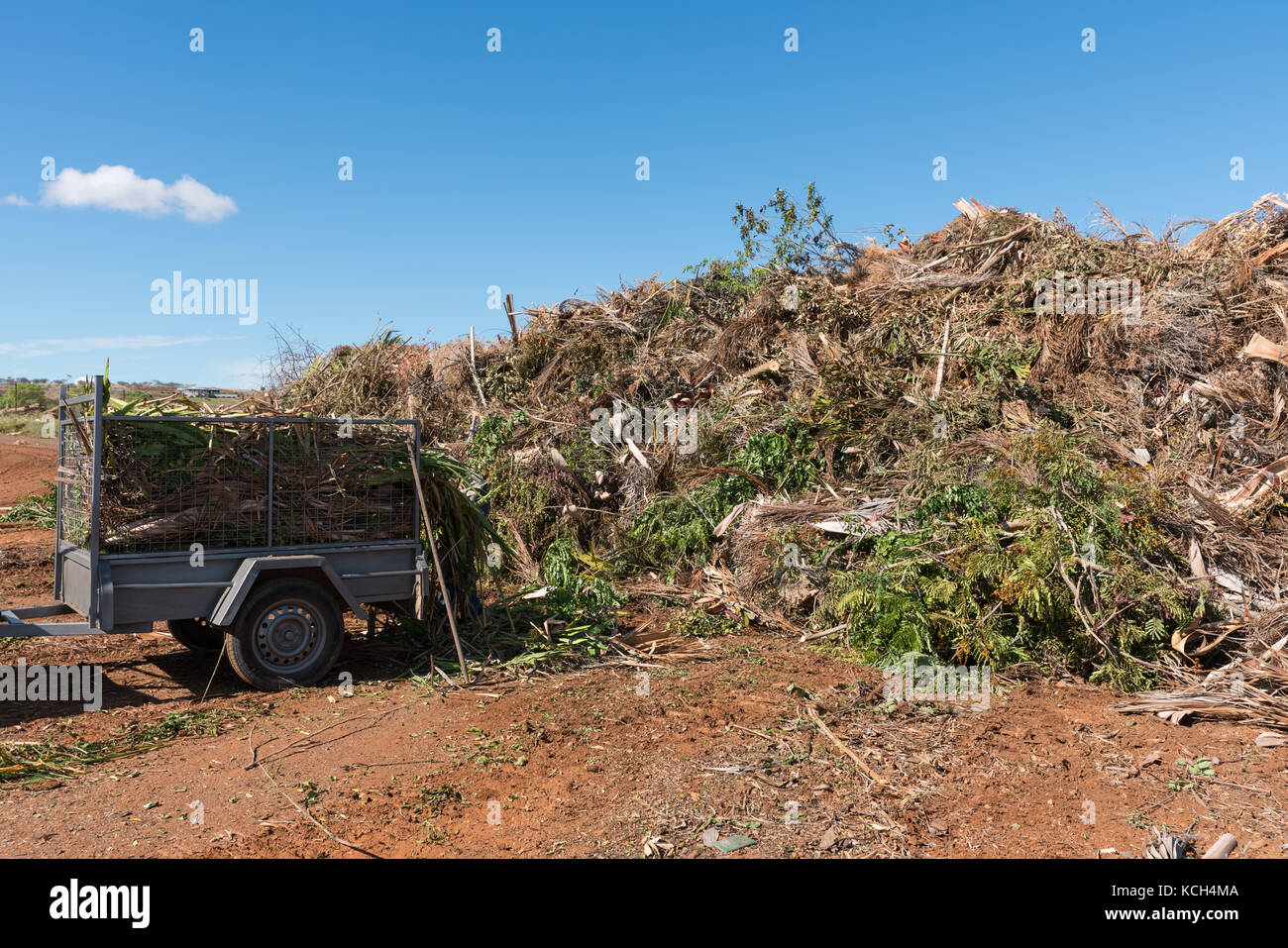 Green waste collection centre with trailer of rubbish to be emptied