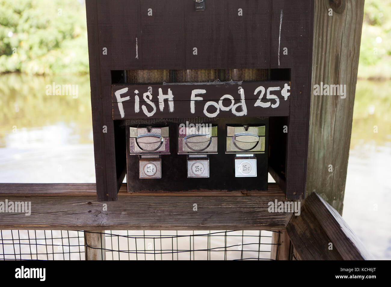Coin operated fish food dispenser USA Stock Photo Alamy