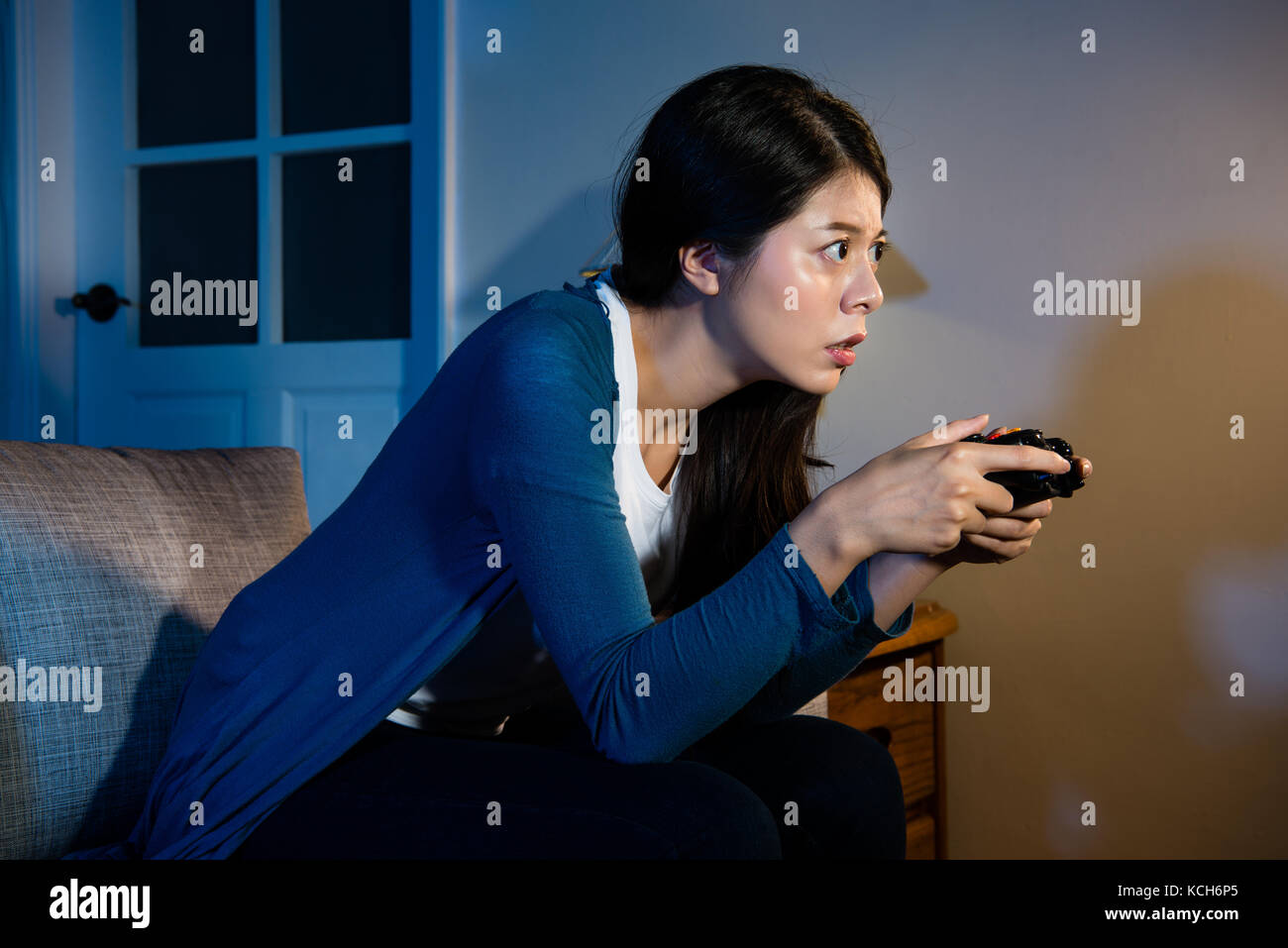 Premium Photo  Boyfriend cheering her beautiul girlfriend while she's playing  online games using wireless controller. room with neon light.