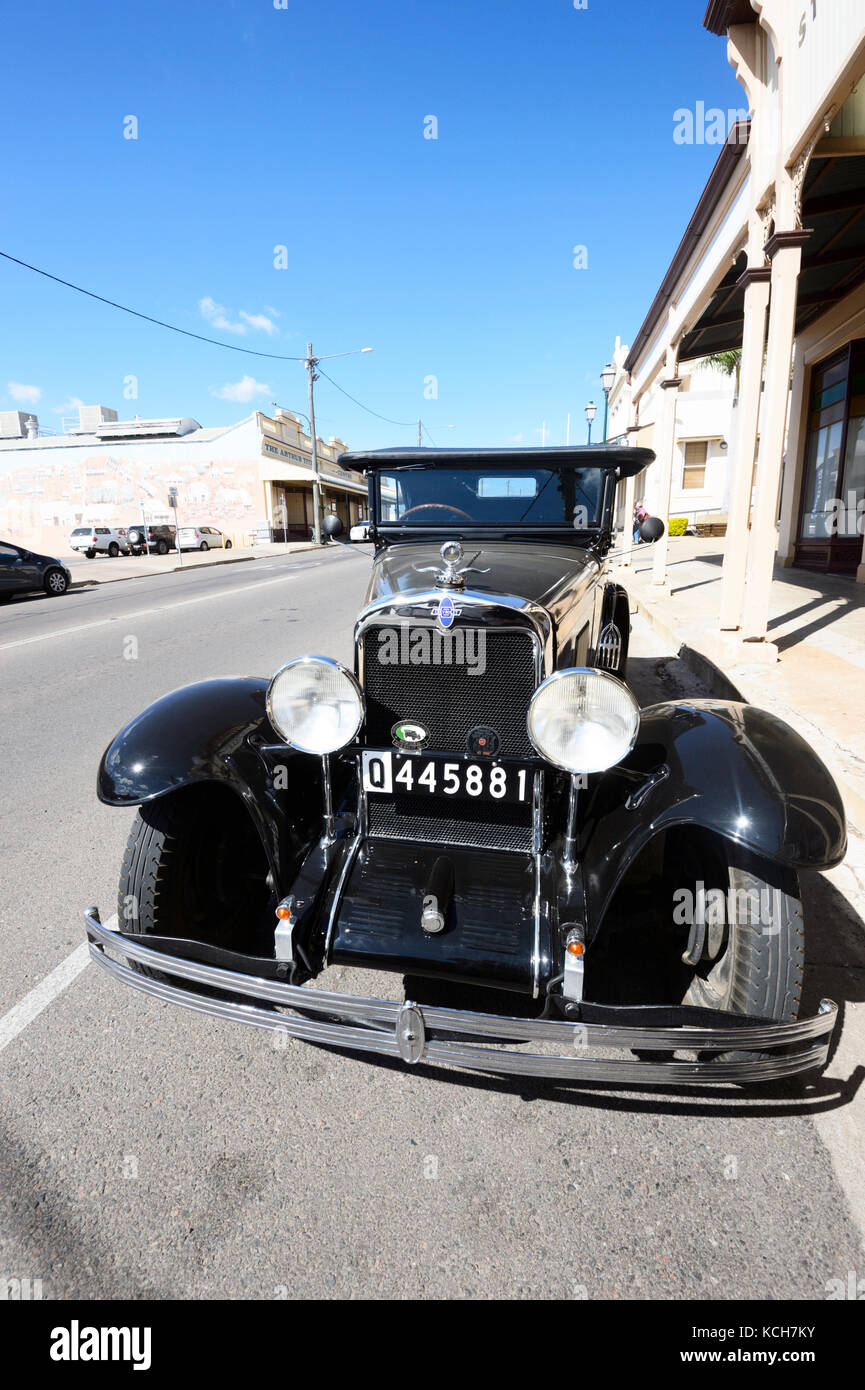 Front view of a vintage Chevrolet car parked in the street in Charters