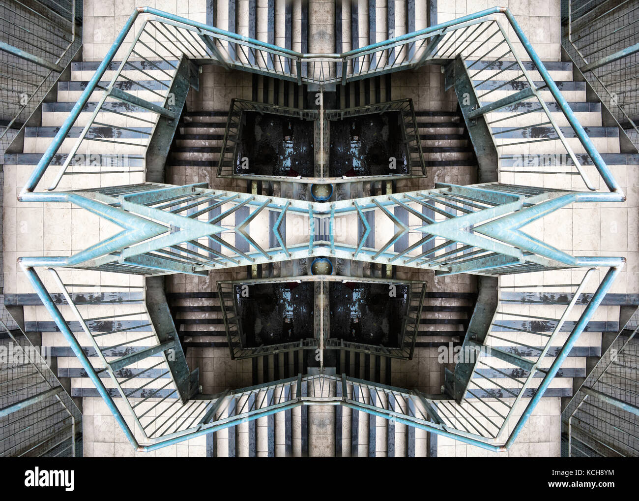 An escher-like view of open-air caged stairwell in wembly Stock Photo