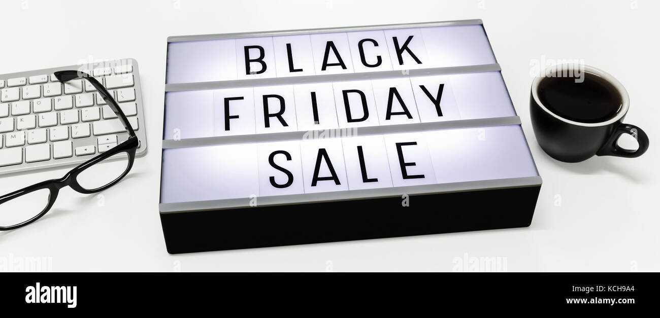 Black friday sale word on lightbox with computer keyboard on white