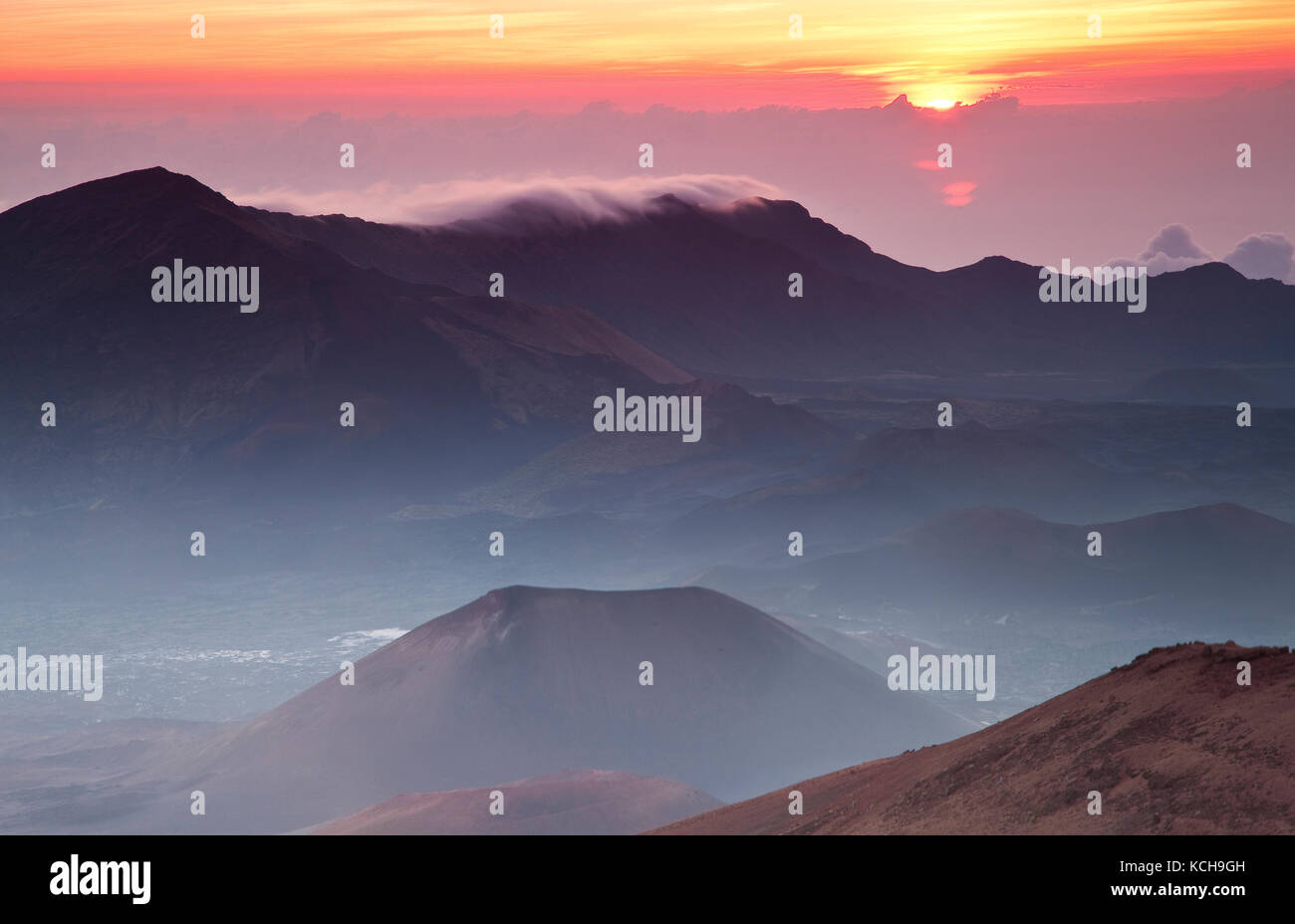 Sun rising above clouds inside Haleakala crater, Haleakala National