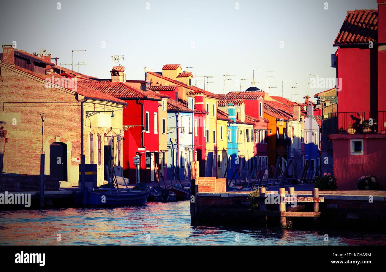 Burano is a little island near Venice in Italy famous for its brightly colored houses. The rainbow of many colors is a major italian tourist attractio Stock Photo