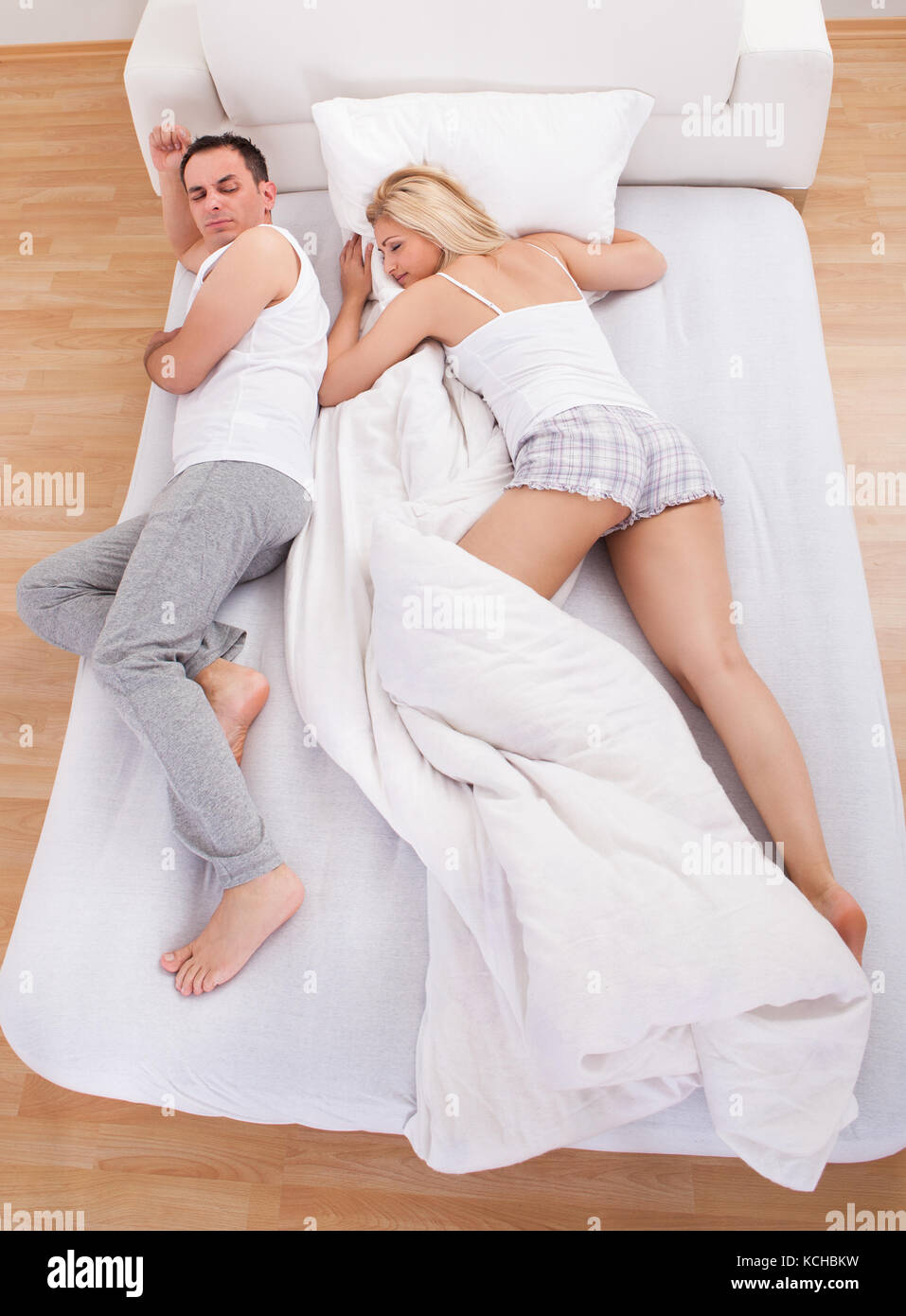 Husband Sleeping With Wife On Bed Stock Photo Alamy