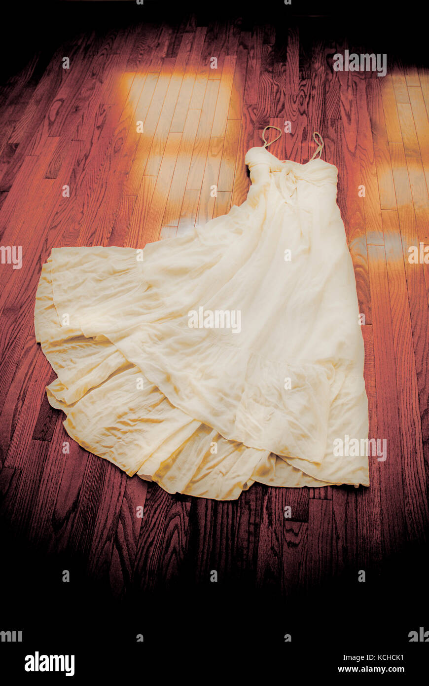 white dress on a wooden floor Stock Photo