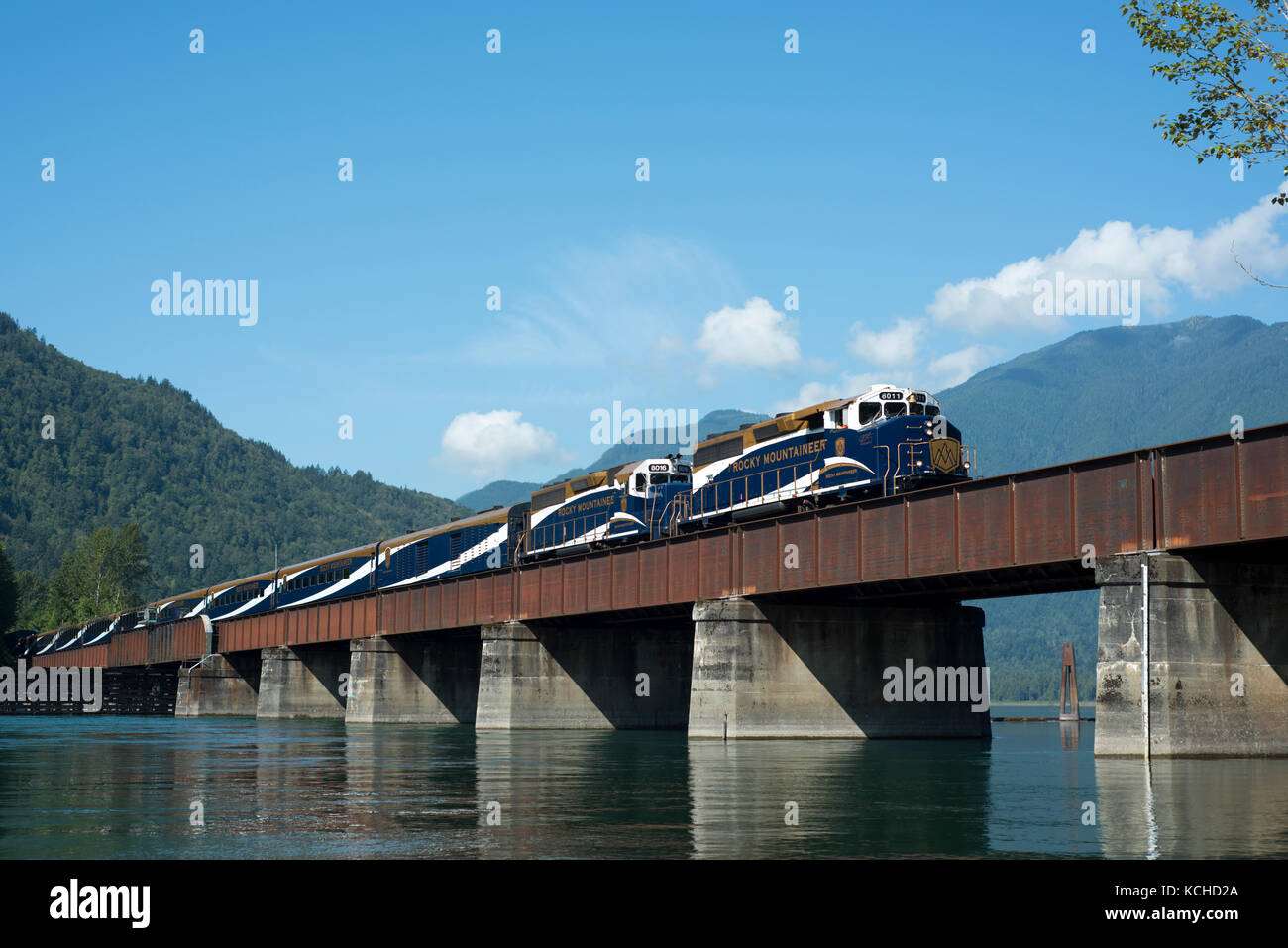 The Rocky Mountaineer crosses the Harrison River in Harrison Mills, British Columbia, Canada. Stock Photo