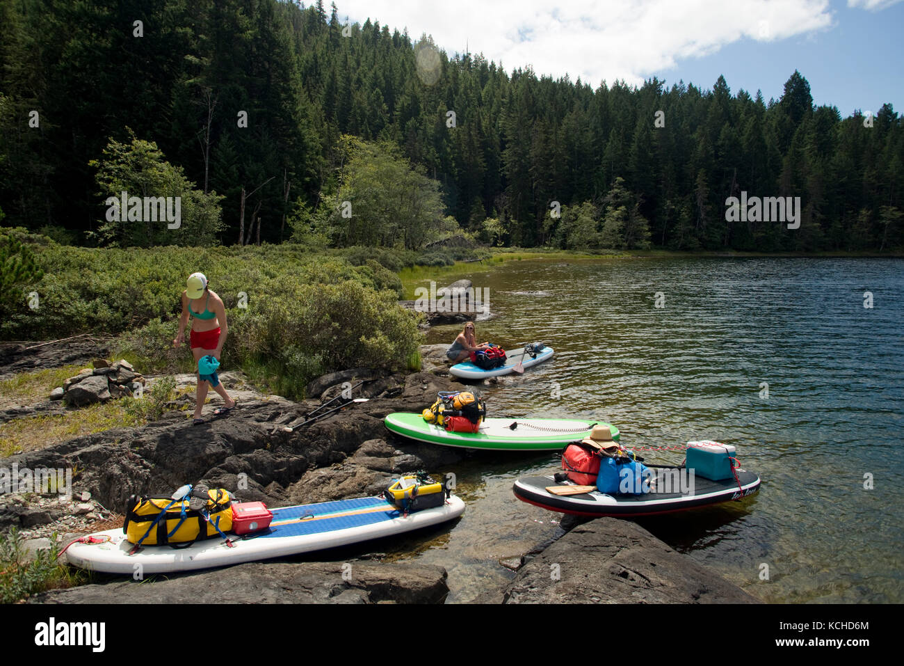 Stand-up paddleboard (SUP) touring in Main Lake Provincial Park, Quadra Island. British Columbia, Canada Stock Photo