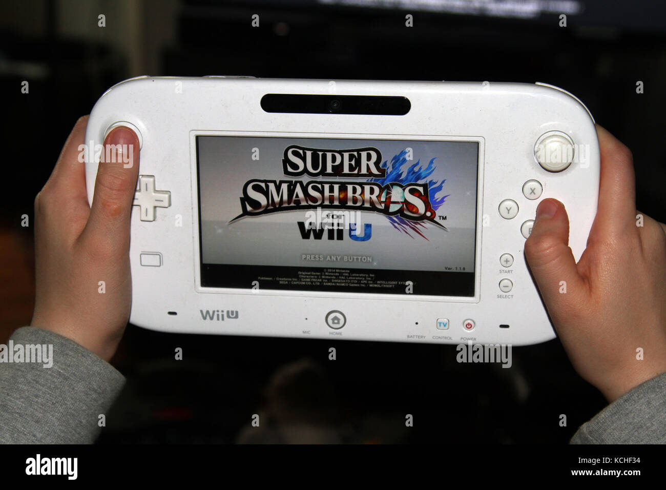 Teenager playing with a Nintendo Wii U video game Stock Photo