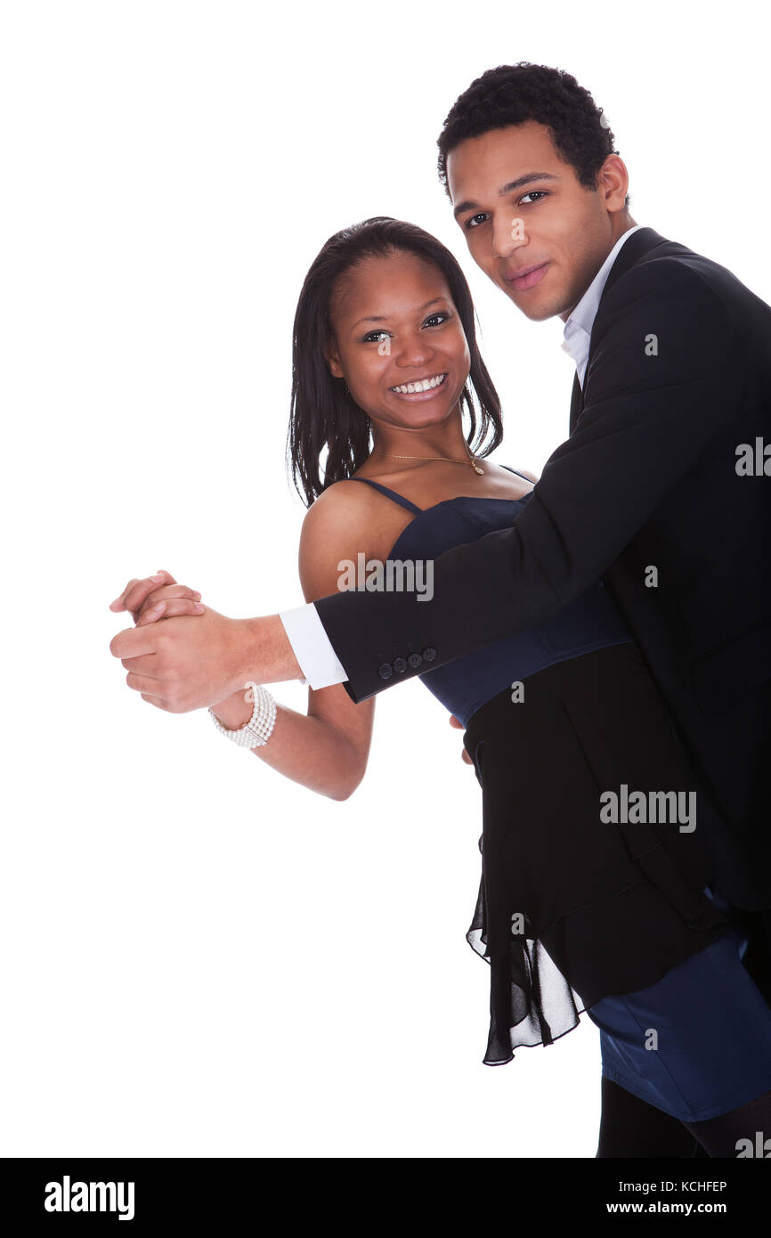 Portrait Of African Couple Dancing Salsa Over White Background Stock Photo