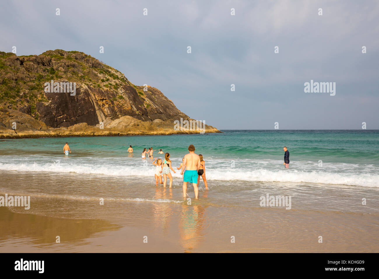 People on Boomerang beach, a popular surf beach on the mid north coast