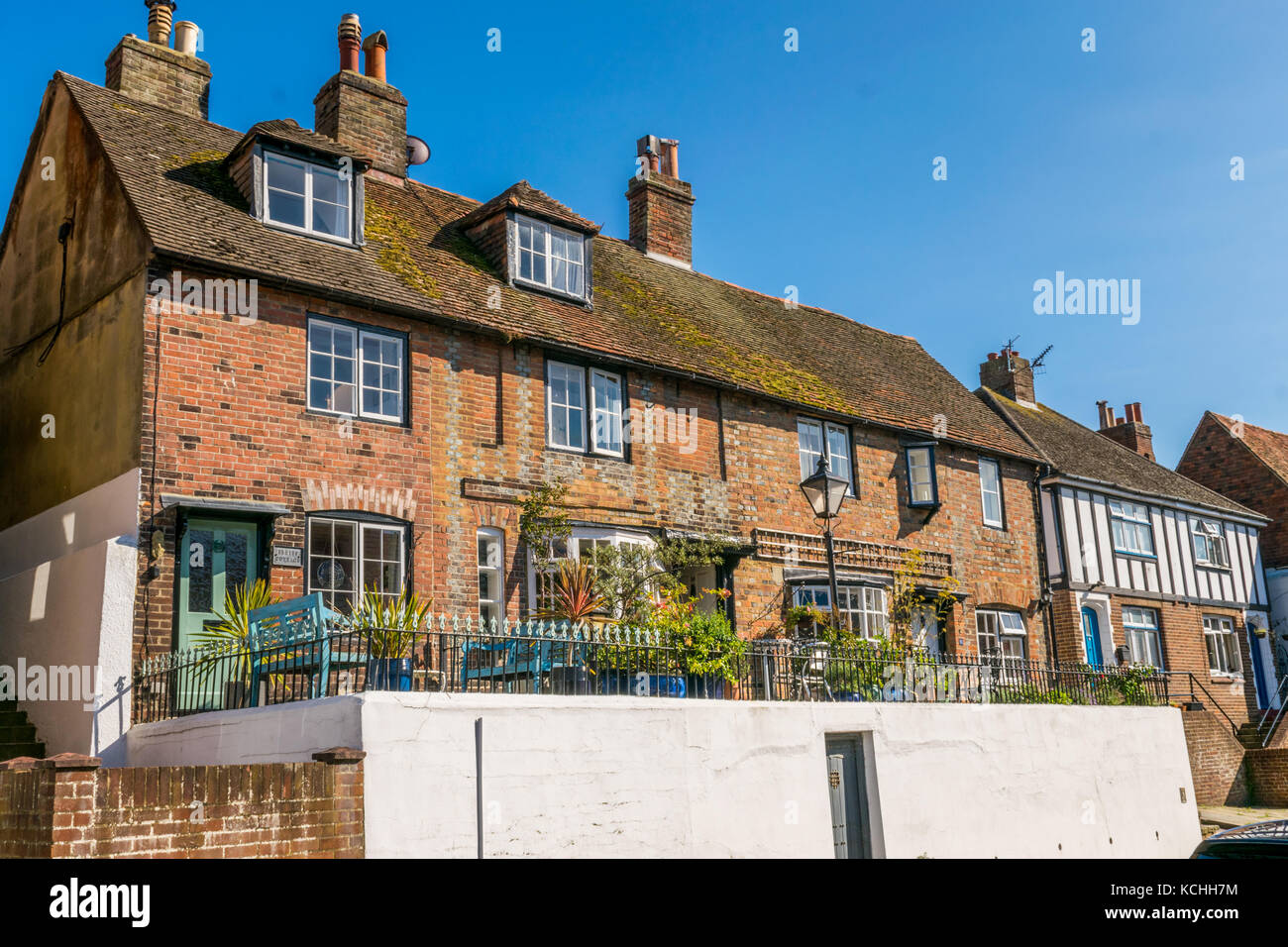 Row of old traditional period red brick cottages in Hastings fishing town Stock Photo