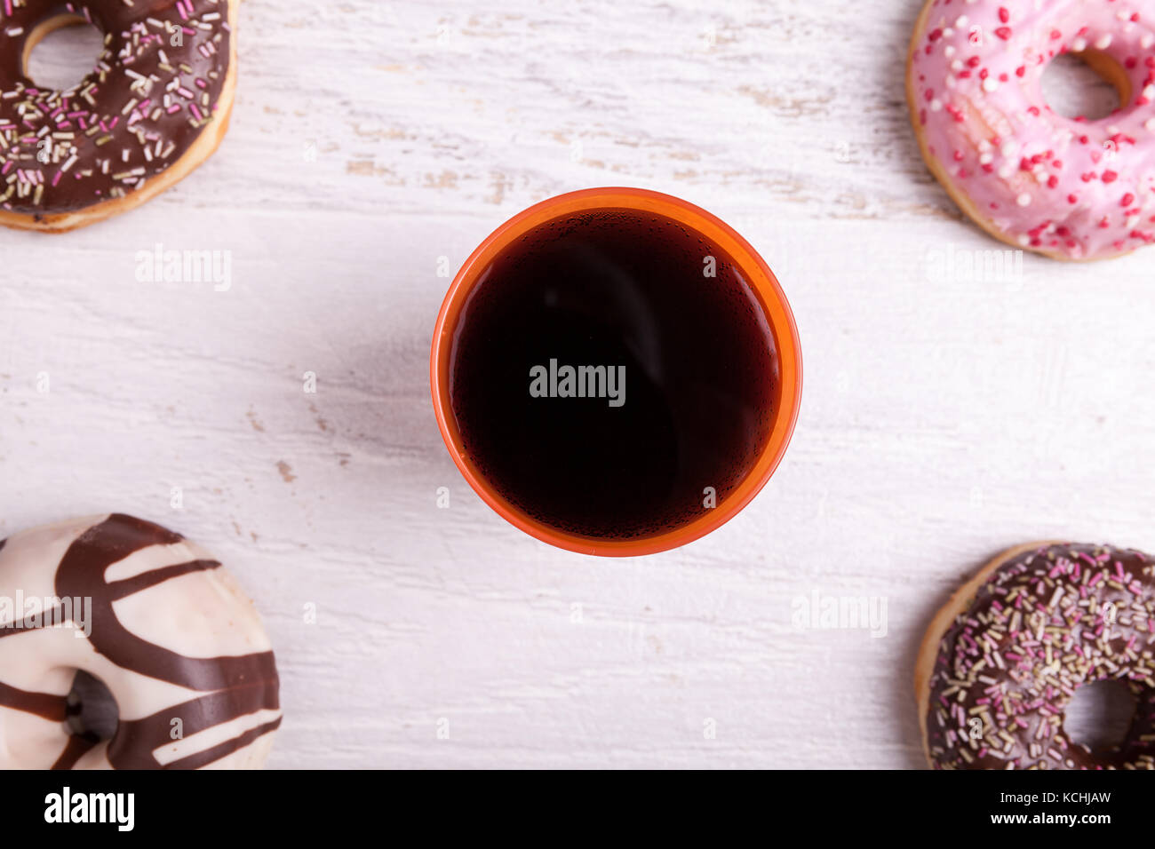 Different type of donuts on white wooden background Stock Photo - Alamy