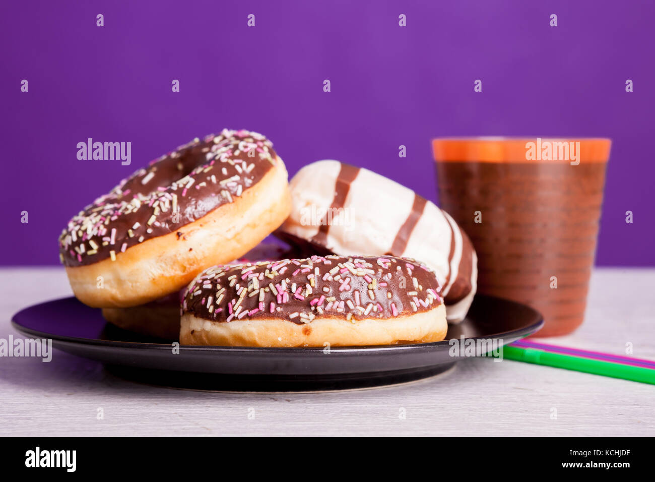Different type of donuts on white wooden background Stock Photo - Alamy