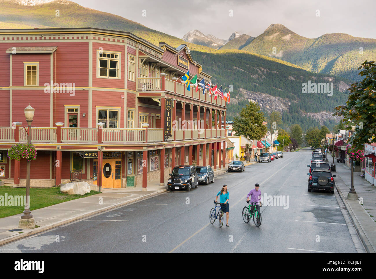 A young couple walking the streets of historic Kaslo, British Columbia Stock Photo