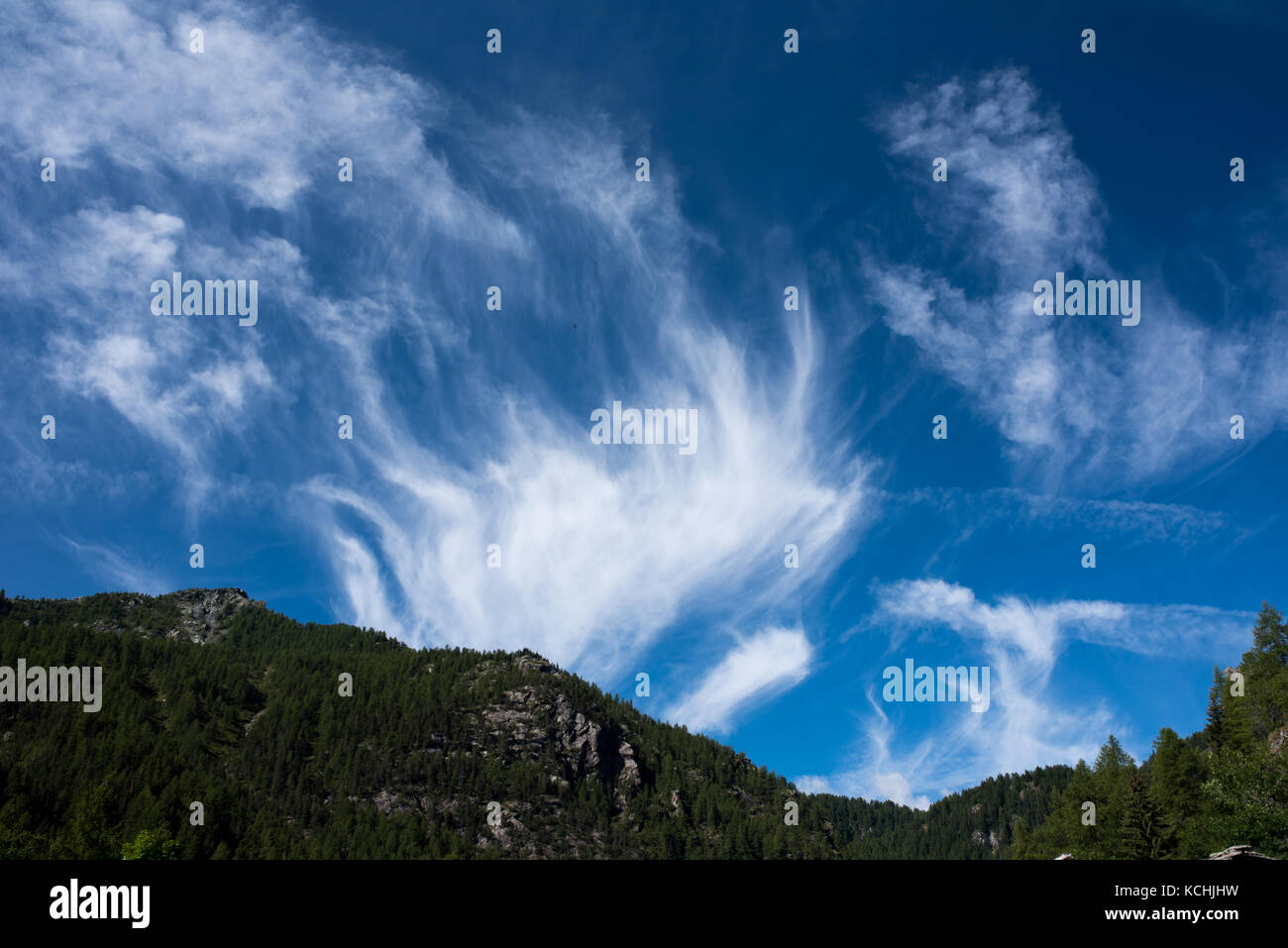 Cirrus Intortus, type of clouds in a mountains landscape Stock Photo