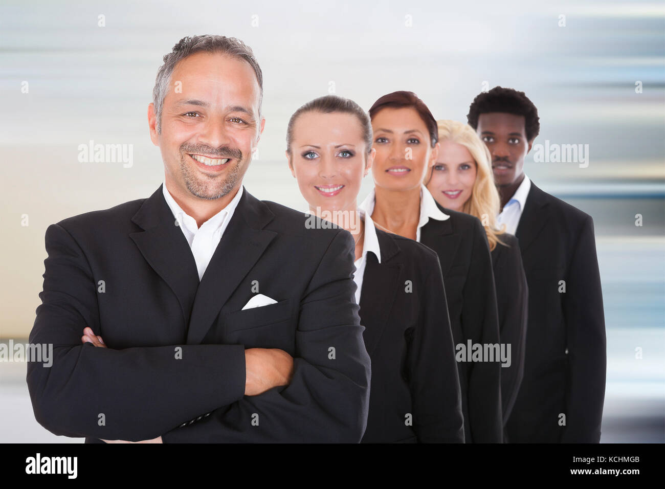 Happy Group Of Business People Standing In A Row At Office Stock Photo ...