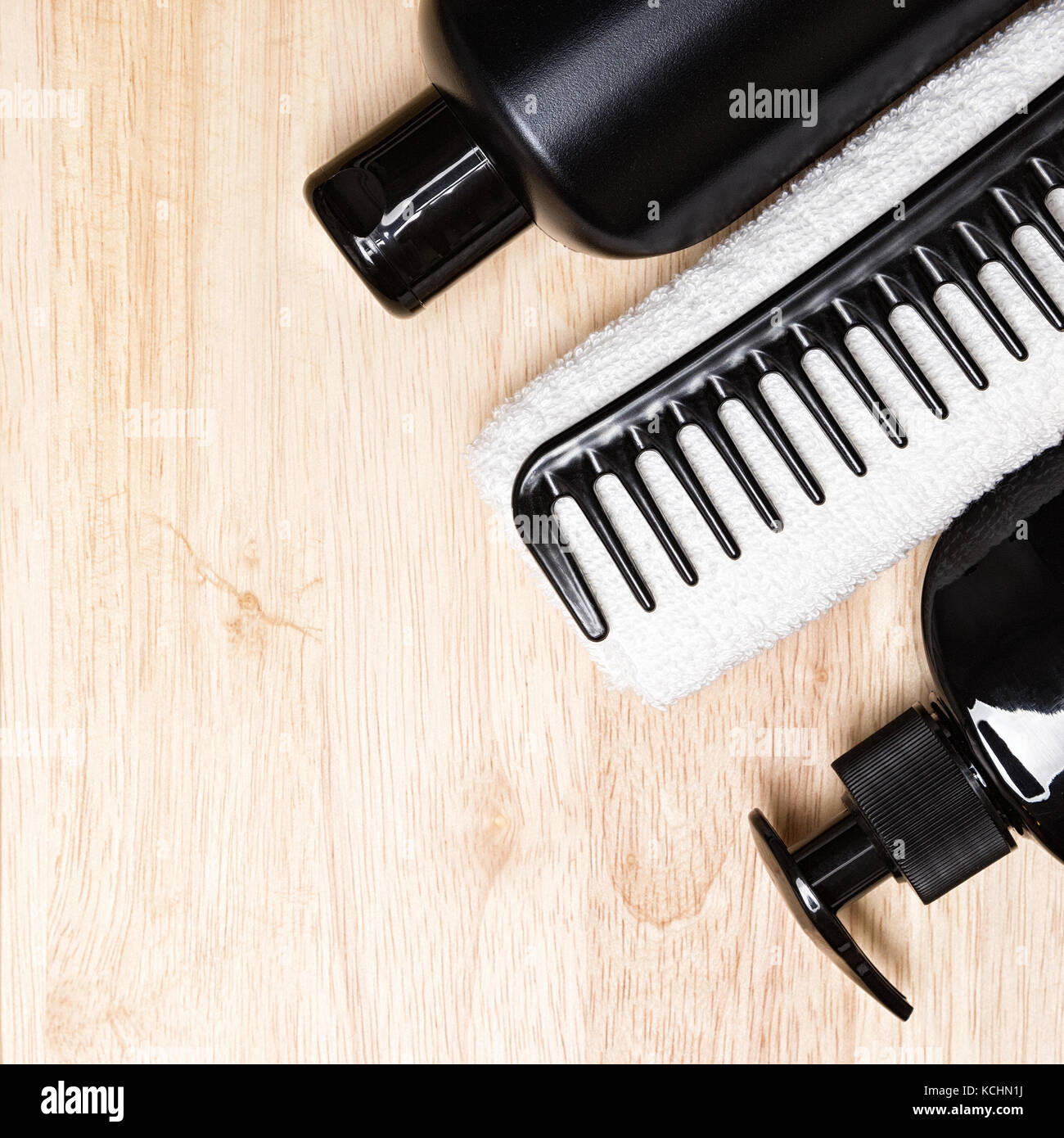 Hair care background. Shampoo, conditioner, wide tooth comb, white