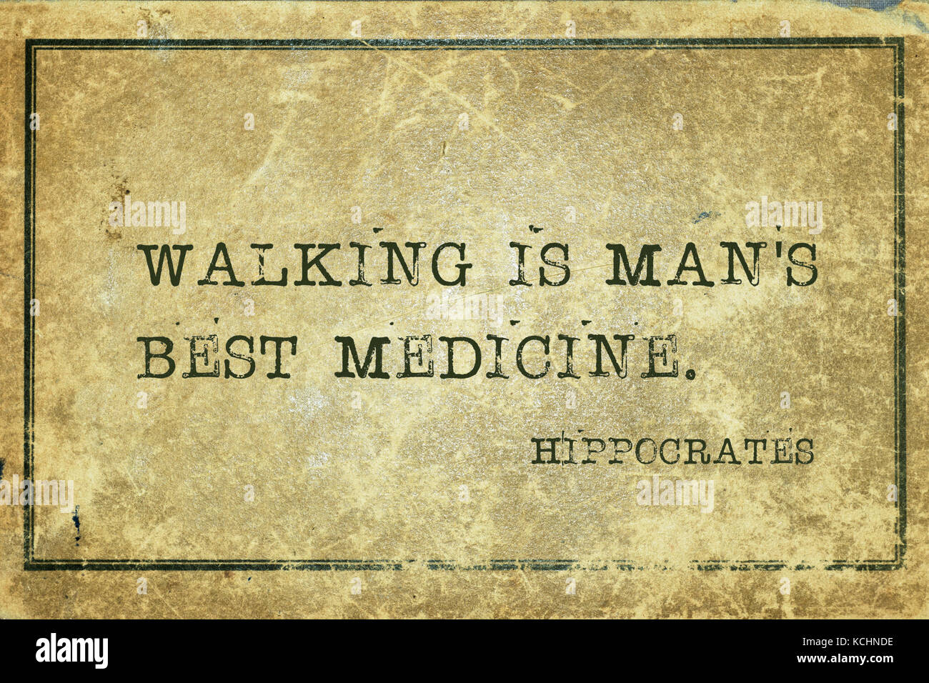 Walking is man's best medicine - famous ancient Greek physician Hippocrates quote printed on grunge vintage cardboard Stock Photo