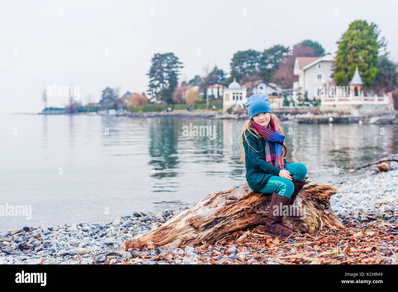 Outdoor portrait of pretty little girl posing next to lake Geneva Stock ...