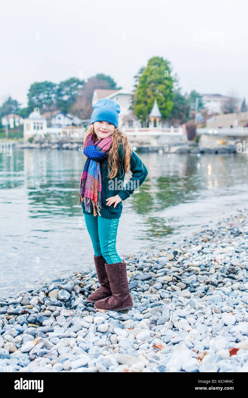 Outdoor portrait of pretty little girl posing next to lake Geneva Stock ...