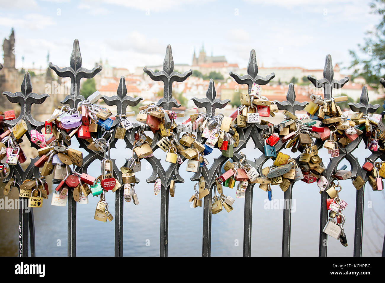 personalised engraved love locks on a bridge where young in love