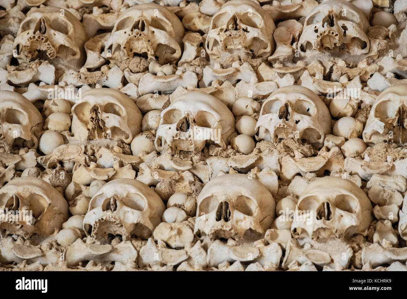 Human skulls and bones in the wall of the Capela dos Ossos (Chapel of Bones). Igreja do Carmo church. Faro, Algarve, Portugal Stock Photo