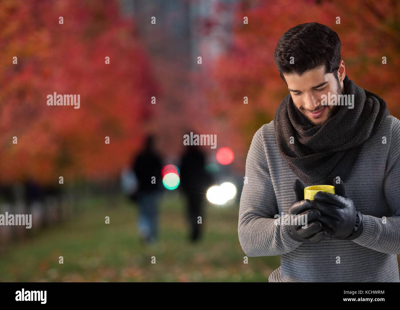 Digital composite of Man in Autumn with phone in city park Stock Photo