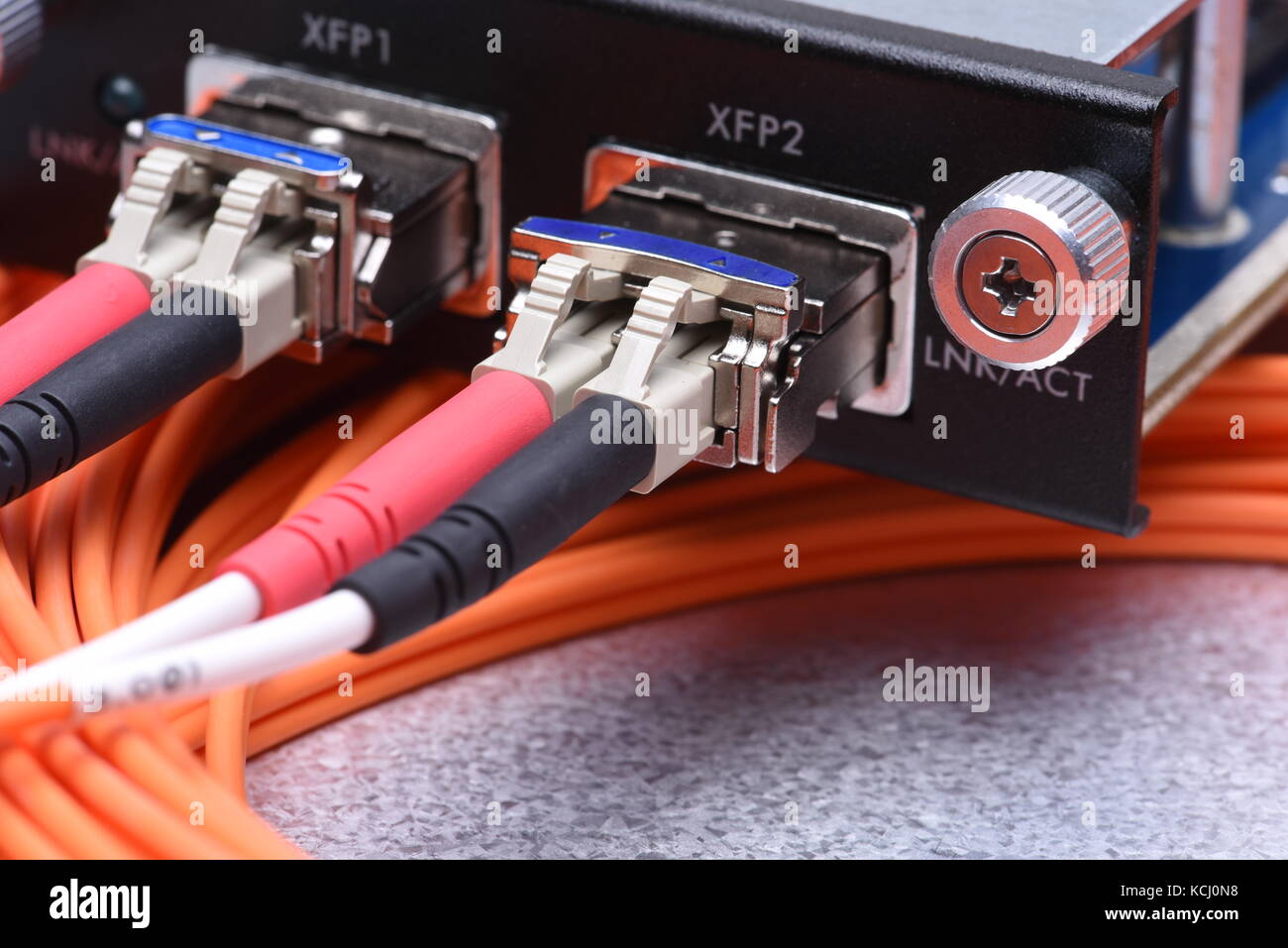 Network optical fiber cables connected to gigabit interface converter Stock Photo