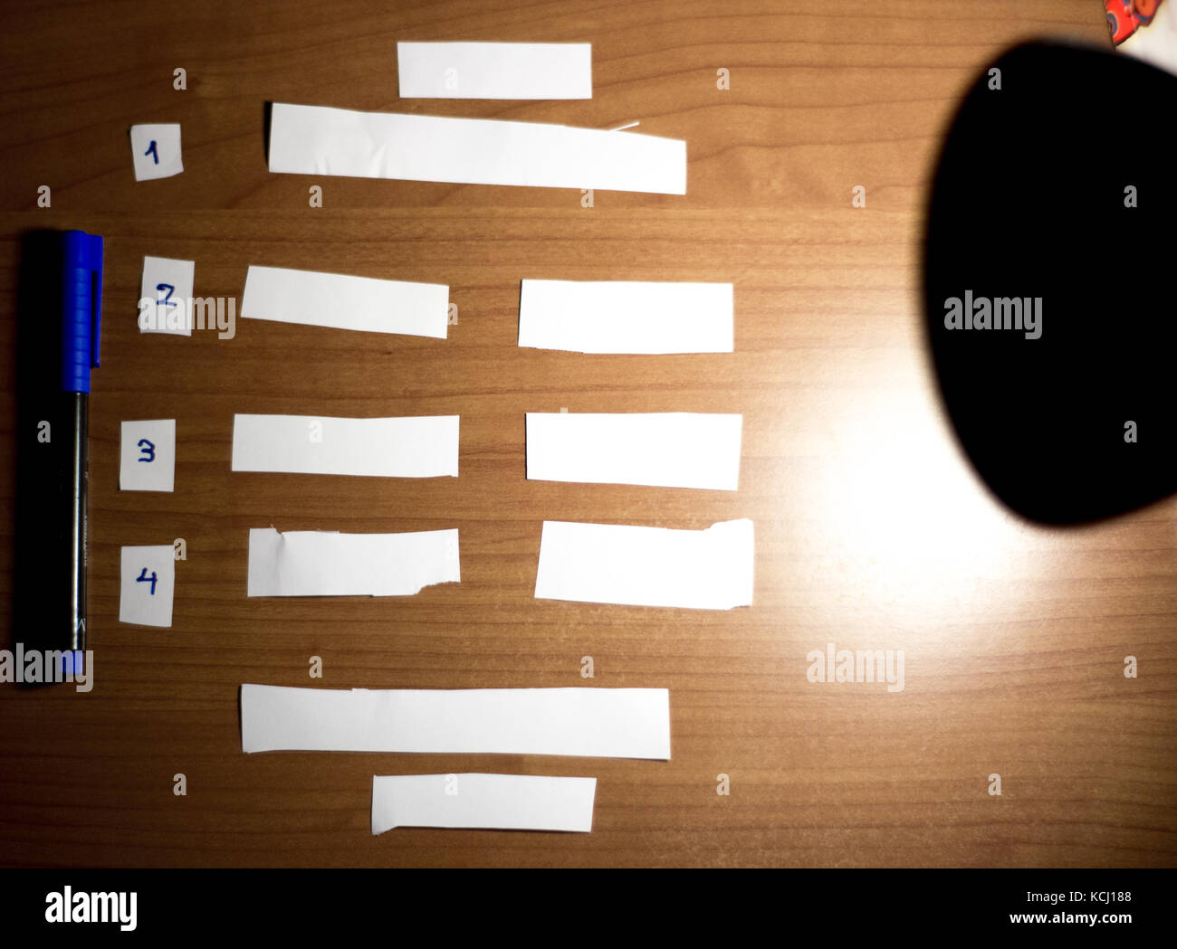 cut empty blank papers on a desk with numbers on the side,to do list planner Stock Photo