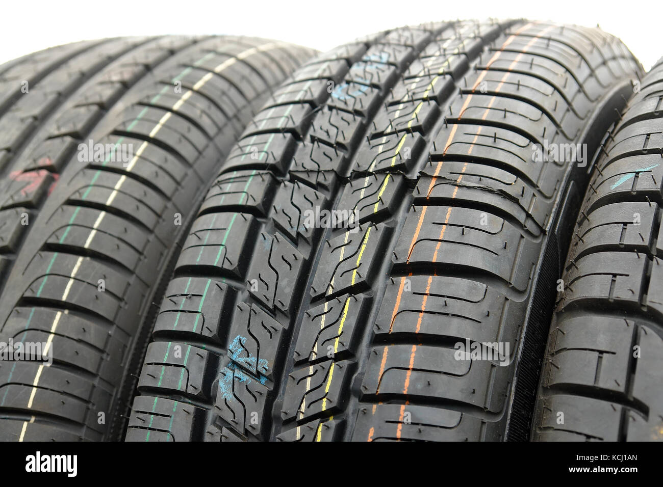 Closeup of row of new car tires Stock Photo