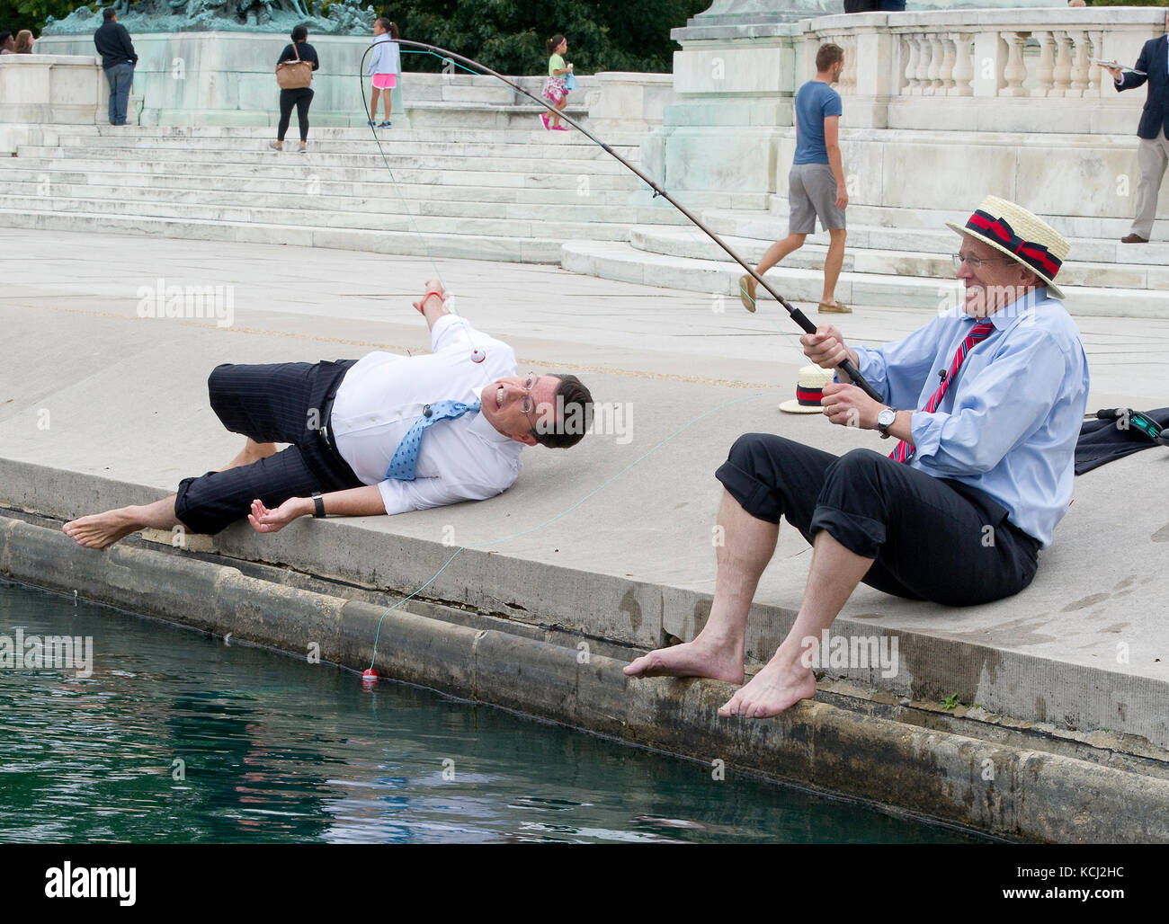 United States Representative Jack Kingston (Democrat of Georgia) catches a big 'fish', Stephen Colbert, host of the Comedy Central show 'The Colbert Report' at the U.S. Capitol Reflecting Pool in Washington, D.C. on Friday, October 3, 2014. Credit: Ron Sachs / CNP (RESTRICTION: NO New York or New Jersey Newspapers or newspapers within a 75 mile radius of New York City) /MediaPunch Stock Photo