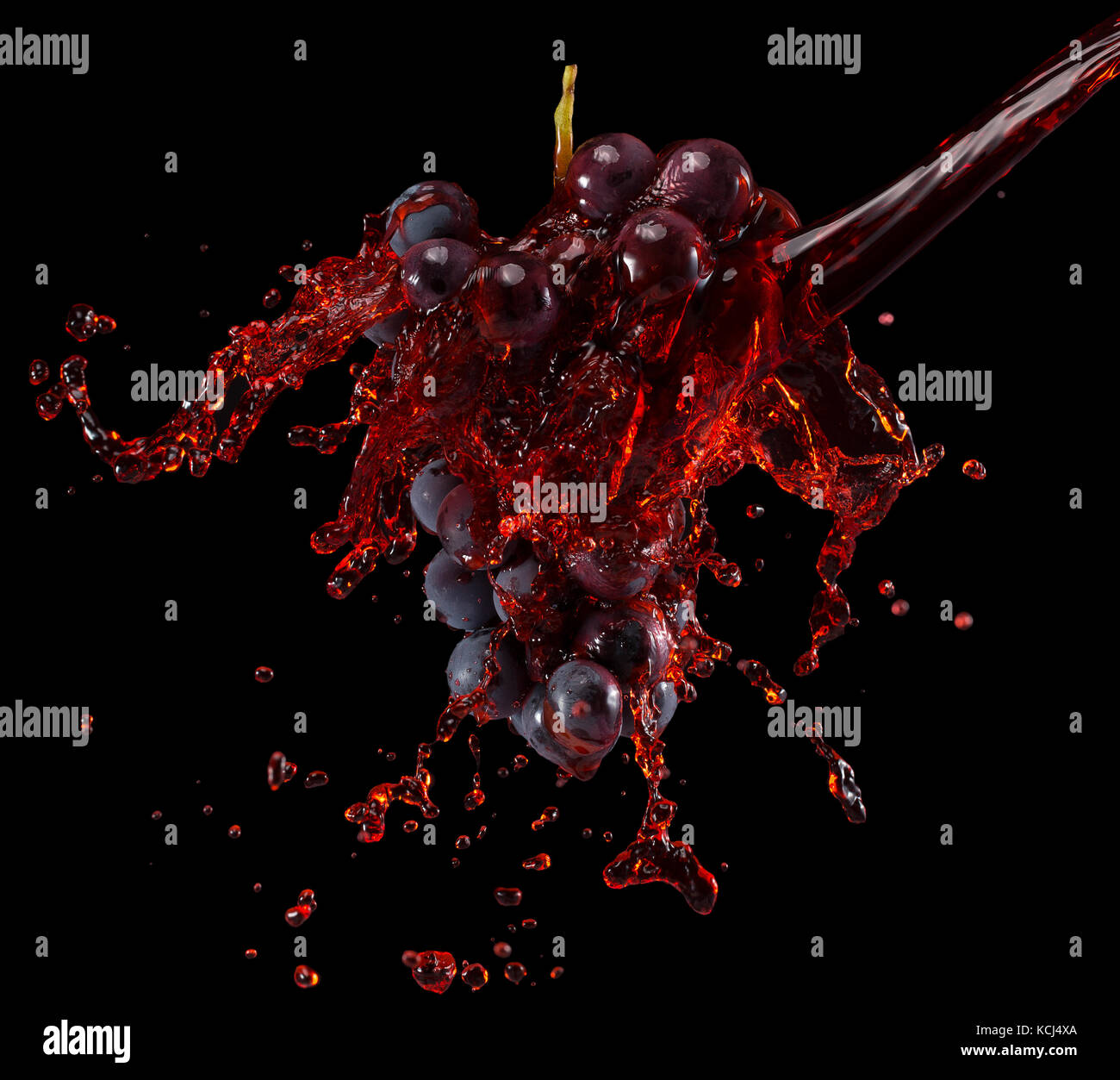 grapes in red wine splash on a black background Stock Photo Alamy