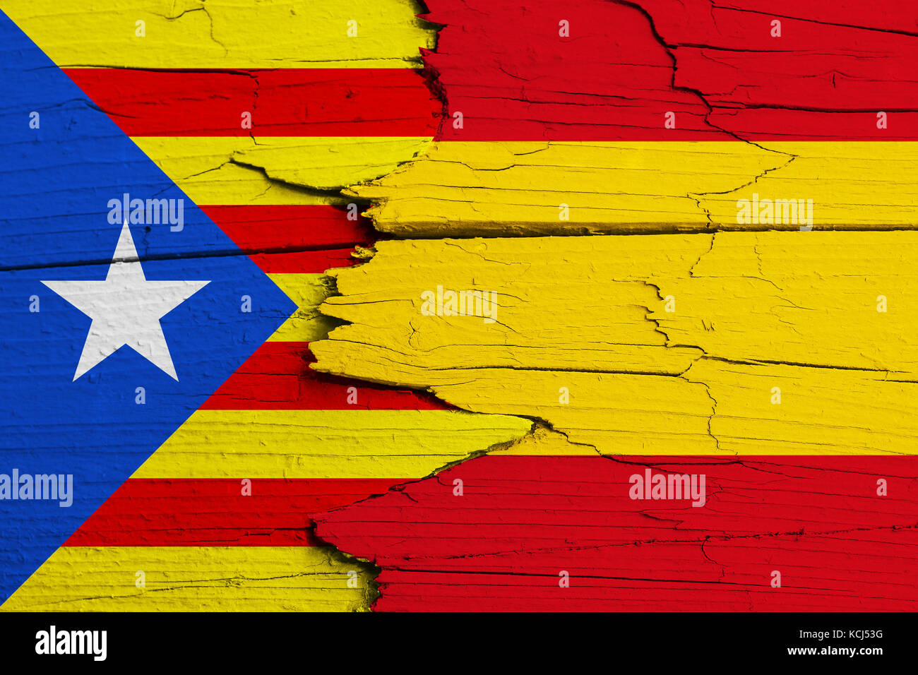 Catalonia independence movement versus Spain: symbolic for ongoing dispute on separation and autonomy. Flags of Catalan separatism and Spanish nationa Stock Photo