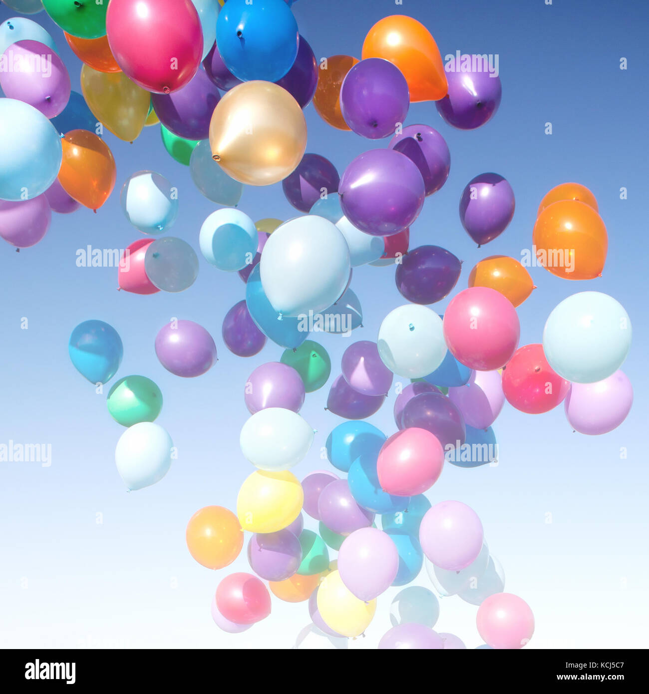 colorful balloons on a blue sky background Stock Photo - Alamy