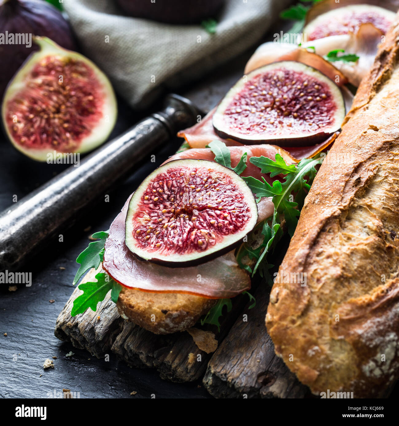 Sandwich with figs and prosciutto Stock Photo