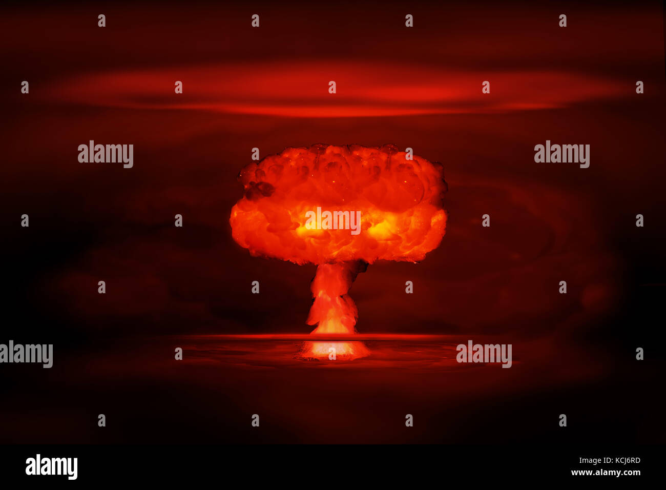 Atomic bomb realistic explosion, red color with smoke on black background Stock Photo