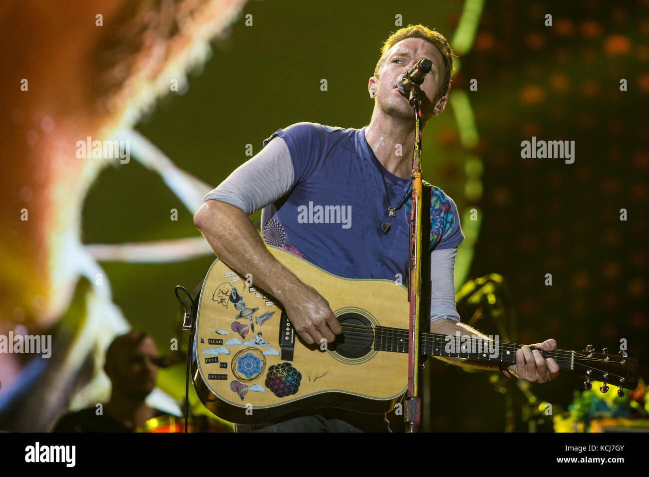 Coldplay band members performing live in *year*