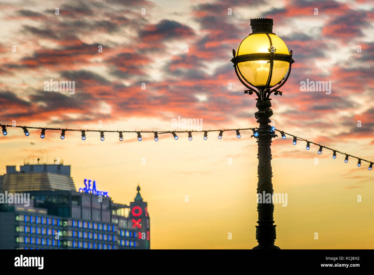 Decorative globe street light lamp post in London at sunset Stock Photo