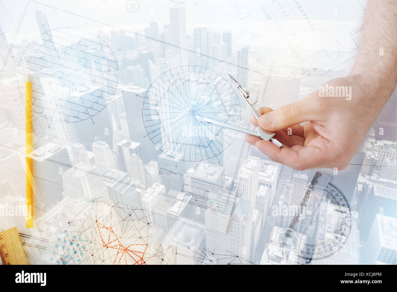 Close up of gifted engineer with compasses Stock Photo - Alamy