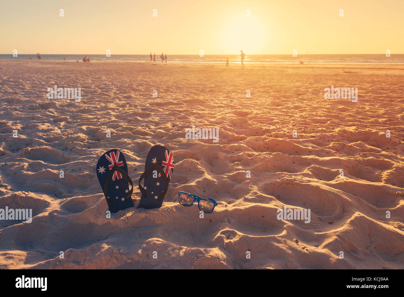 Australian sandals flip flops thongs with Australian flag on wide sandy  beach in early morning sun. Taken in South Australia Stock Photo - Alamy