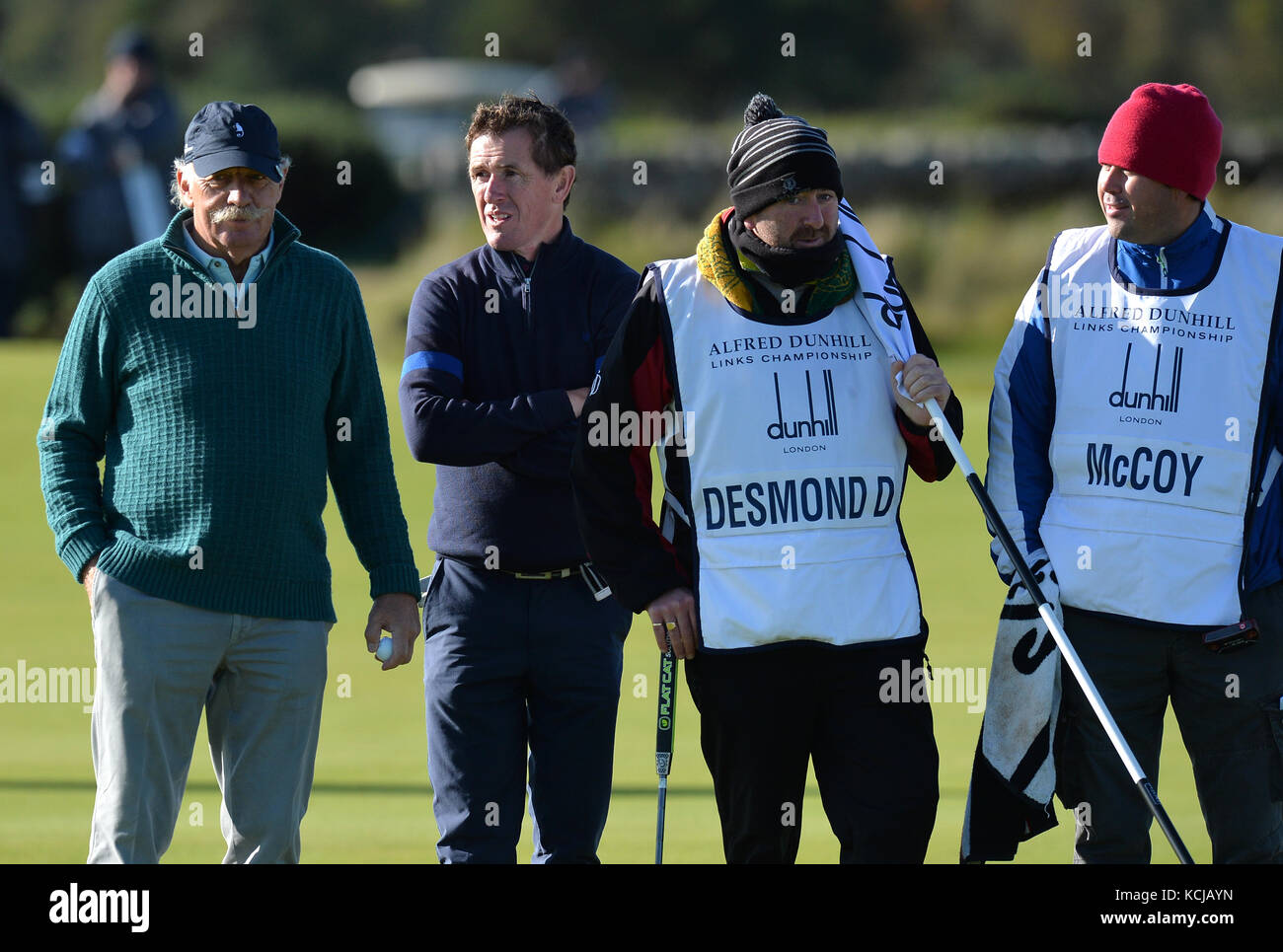 Dermot Desmond, AP McCoy and caddies during day one of the Alfred Dunhill Links Championship at St Andrews. Stock Photo