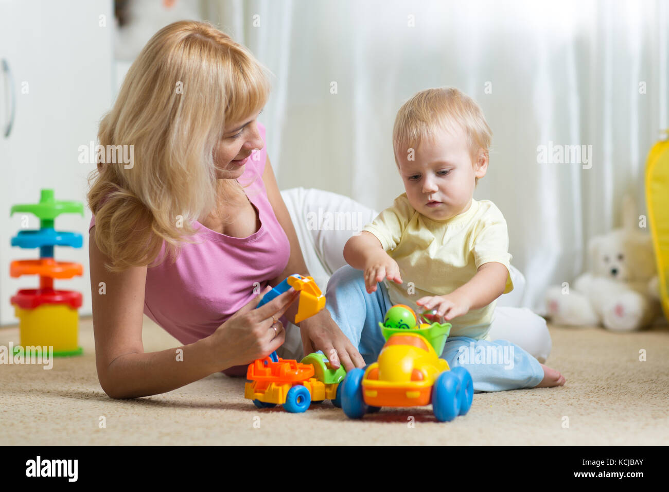 cute mother and child boy play together indoors at home Stock Photo