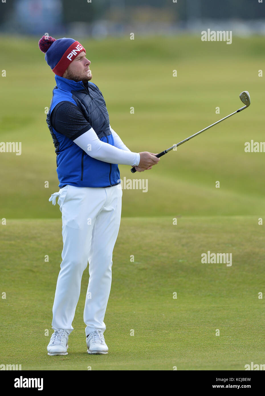 England's Tyrrell Hatton eats a hot dog during day one of the Alfred Dunhill Links Championship at St Andrews. Stock Photo