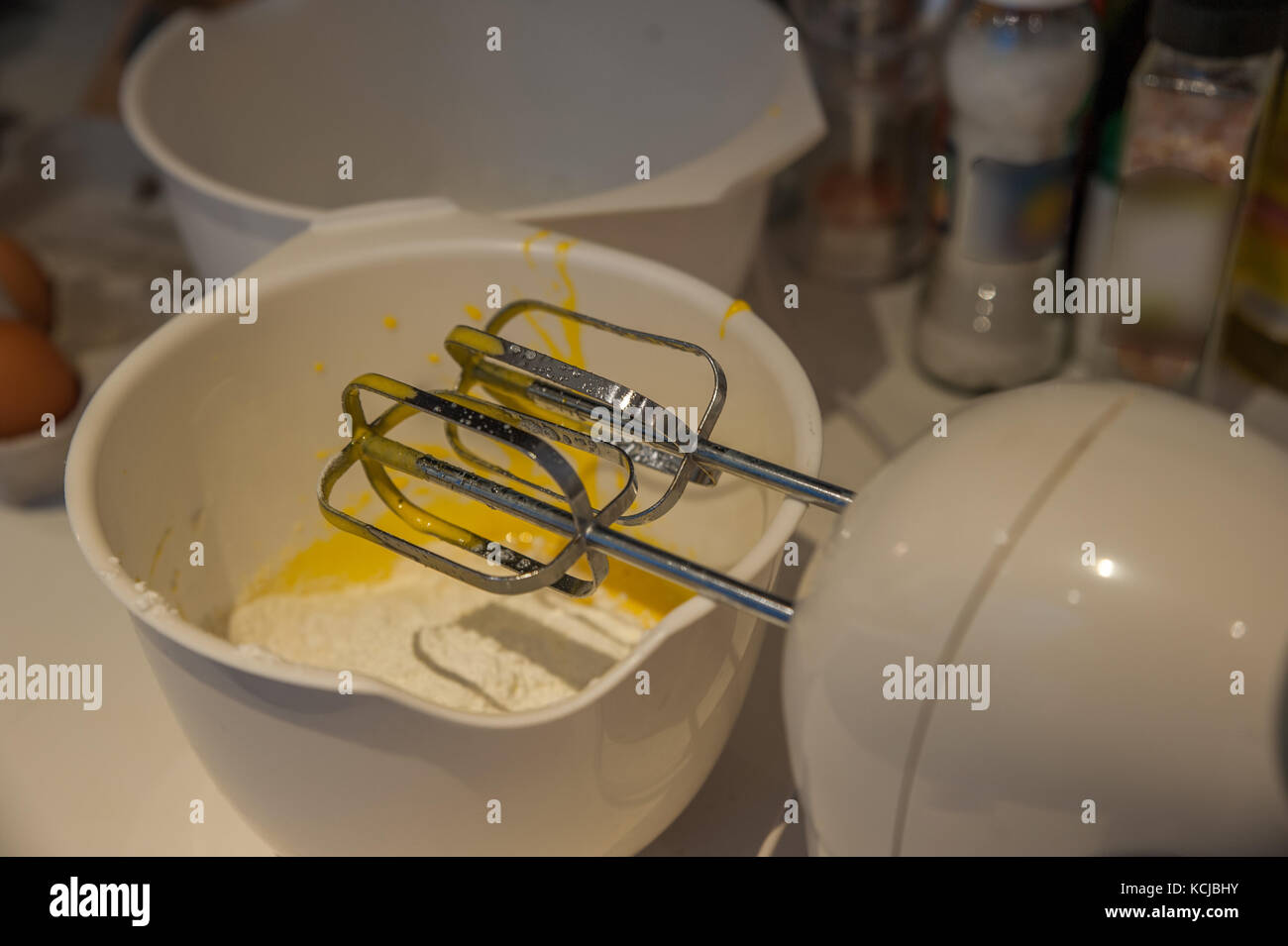 White kitchen mixer, mixing eggs and flour Stock Photo Alamy